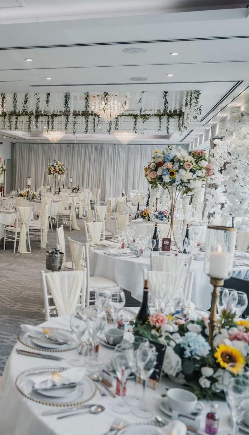 Ballroom styled with hanging wisteria and tall floral centrepieces